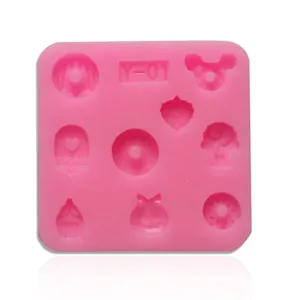 Detail showing pink silicone chocolate mold with various heart and cupcake shapes