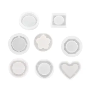 Collection of white silicone molds in heart, flower, and geometric shapes for resin DIY