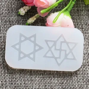 Transparent silicone resin mold featuring two hexagram star shapes for DIY crafting.
