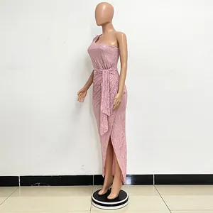 Side view of elegant pink sequined one-shoulder maxi dress with ruched waist and front slit.