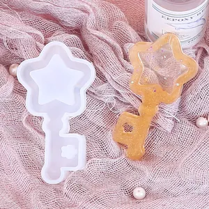 Detailed view of a star key shaped DIY silicone mold with a glittery resin sample