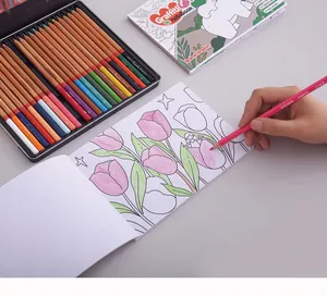 Close-up of a child coloring a tulip illustration with vibrant colored pencils