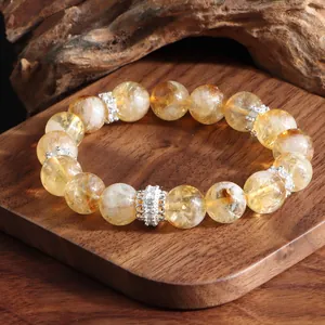 Exquisite close-up of natural citrine beaded bracelet with ornate silver spacers