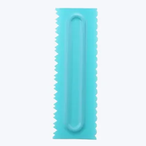 Detailed view of a blue plastic cake cream scraper with dual-patterned edges