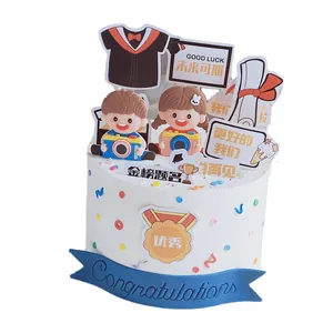 Graduation cake topper set with cartoon boy, girl and camera decorations for celebrations