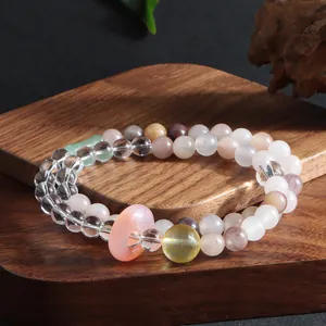 Detail view of double-strand crystal bracelet with amethyst and rose quartz beads