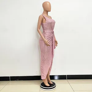 Side view of elegant pink one-shoulder sequin dress with pleated waist detail