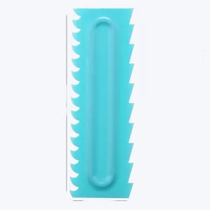 Turquoise plastic cake scraper with serrated edges for cream and icing patterns
