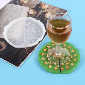 Silicone mold for DIY resin coasters with dandelion pattern and finished green coaster