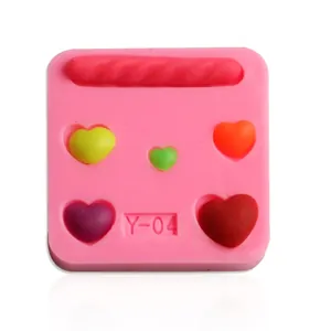 Detail of pink silicone mold with heart shapes for chocolate and baking decoration