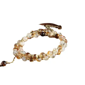 Handcrafted natural citrine tower crystal and tiger eye bead bracelet with gold accents