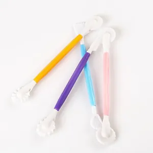 Detail view of 4-piece colorful double-ended fondant sculpting and cake carving tools
