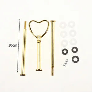 Detail view of gold heart-shaped handle and rods for DIY tiered cake stand