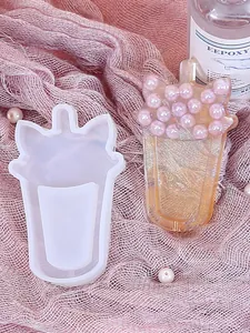 Detail view of cat-ear bubble tea silicone mold with a finished resin charm sample