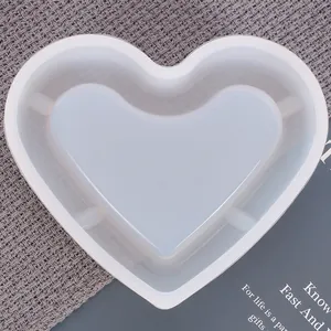 Macro view of a large heart-shaped silicone resin mold for DIY ashtray crafting