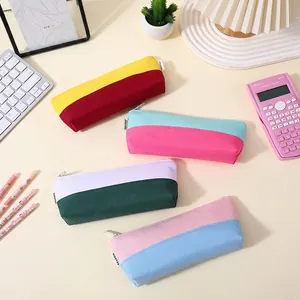 Color-blocked Oxford cloth boat-shaped pencil cases in various pastel colors
