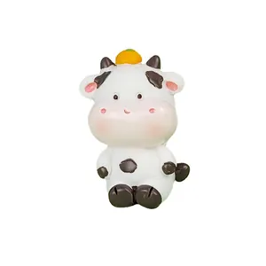 Cute resin cartoon cow cake topper figurine with orange for party decor