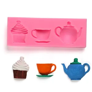 Detailed view of the silicone mold showing teapot and cupcake shapes with finished samples