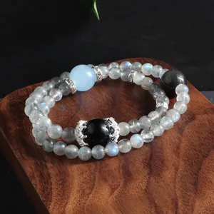 Detailed view of a double-strand natural labradorite beaded bracelet with blue stone accent.