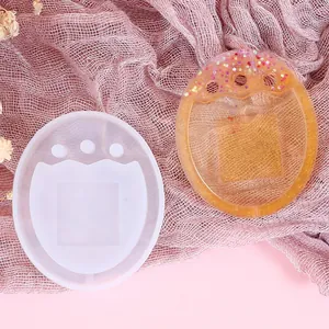 Detailed view of the semi-transparent silicone quicksand mold and the finished amber resin piece