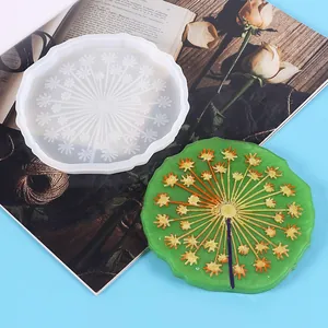 DIY silicone mold for dandelion patterned resin coaster shown with a finished sample