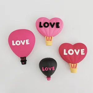 Romantic love-themed hot air balloon cake toppers for Valentine's Day baking decoration.