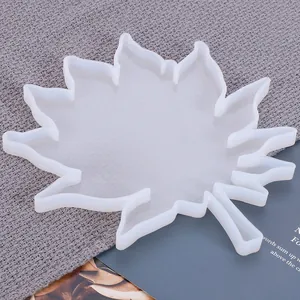 Detailed view of translucent maple leaf silicone mold for DIY resin coaster crafting.