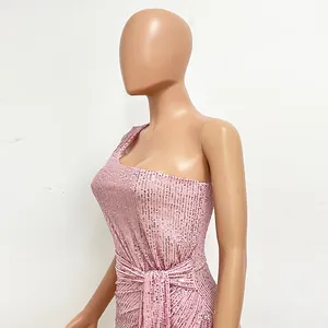 Side view of pink sequined one-shoulder dress with pleated waist detail