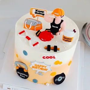 Fitness themed cake topper set featuring gym equipment and muscle man ornaments