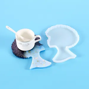 Silicone mold for DIY resin coaster featuring a finished profile-shaped coaster and tea cup