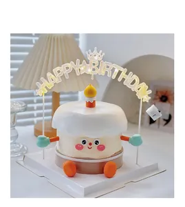 Close-up detail of cute cartoon cake ornament with a glowing Happy Birthday LED topper