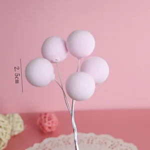 Detailed view of 2.5cm pink clay balloon cake toppers for birthday party decoration.