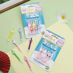 Colorful spiral birthday candles with cute flower and heart designs for party decoration.
