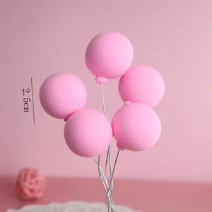 Detailed view of 2.5cm pink balloon cake toppers on silver wire