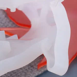 Detailed macro view of a translucent white leaf-shaped silicone mold for DIY resin craft