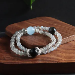Close-up of natural labradorite stone double layer bracelet with blue and black beads