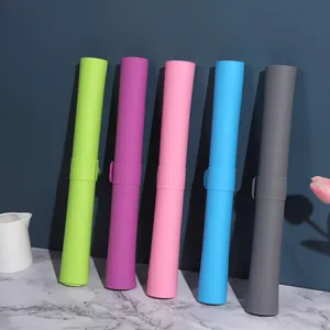 Five colorful rolled silicone pastry mats with storage buckles shown on a marble surface