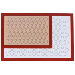 Detail view of non-stick silicone baking mats with macaron circle guides and glass fiber mesh