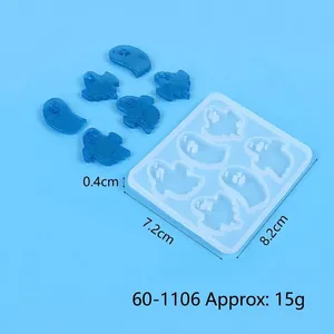 Detail view of Halloween ghost silicone mold with blue resin charms and dimensions
