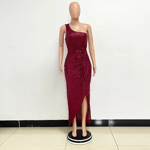 Full-length detail of a burgundy sequin one-shoulder dress with pleated waist and side slit