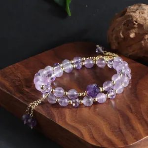 Elegant double-layered amethyst beaded bracelet with gold spacers and tassel detail