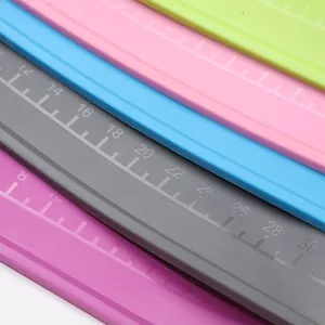 Macro view of silicone baking mats with precise scale markings for measurements.