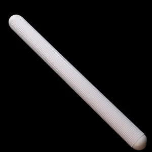 Detail of white textured hollow rolling pin for fondant cake embossing and baking