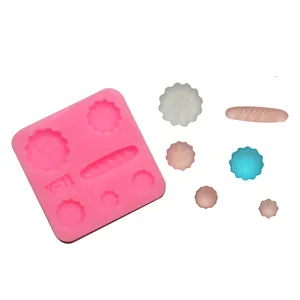 Pink silicone baking mold Y-11 with various biscuit and bread shapes and resin samples