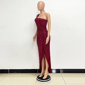 Side view of a stunning burgundy one-shoulder sequined maxi dress featuring waist tie.