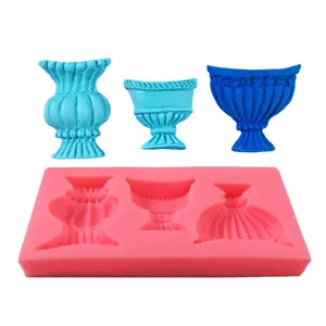 Silicone mold featuring three vintage vase and cup shapes for fondant cake decorating.