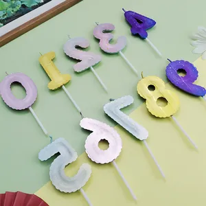 Detailed view of colorful balloon-shaped birthday candles numbered zero through nine