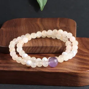 Handgemaakte dubbelstrengs kristallen armband met perzikparels en amethist-focussteen