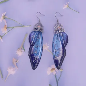 Ätherische S925 Silber-Ohrringe mit blau-violetten Schmetterlingsflügeln im Verlauf