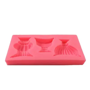 Detail view of pink silicone mold with vintage wine cup and vase cavities for baking